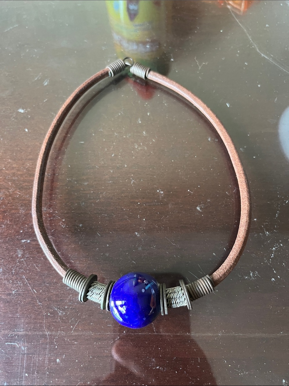 Boho surfer style leather cord necklace with a cobalt blue glass or ceramic bead